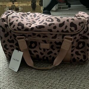 brand new CALPAK bag. never used